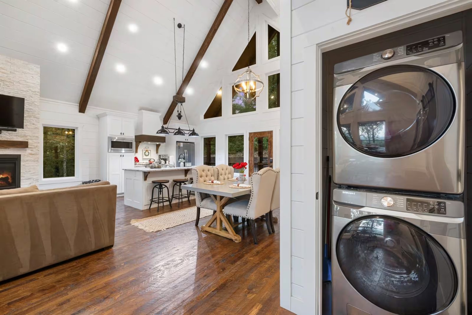 Open living space with a stacked washer and dryer.